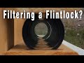 Shooting through 17 Lens Filters with a Flintlock Rifle