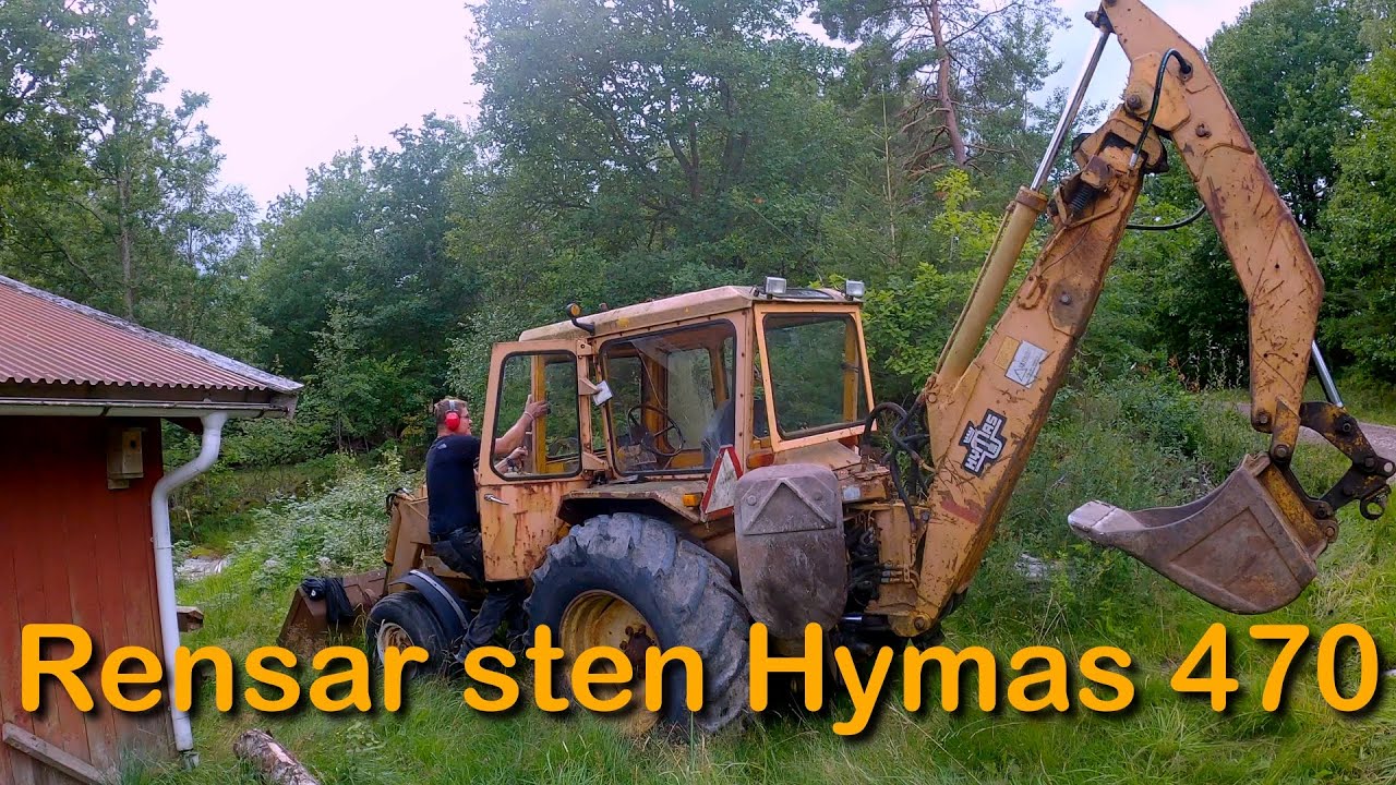 Hymas 470 flyttar sten (Peter kör Hymas 470 traktorgrävare för första gången)