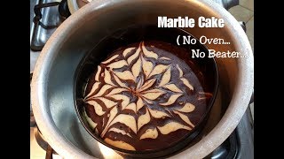 #marblecake #noovencake #spongycake marble cake is a perfect treat to
your taste buds and eyes as well. it looks so beautiful when baked
with this pattern. t...