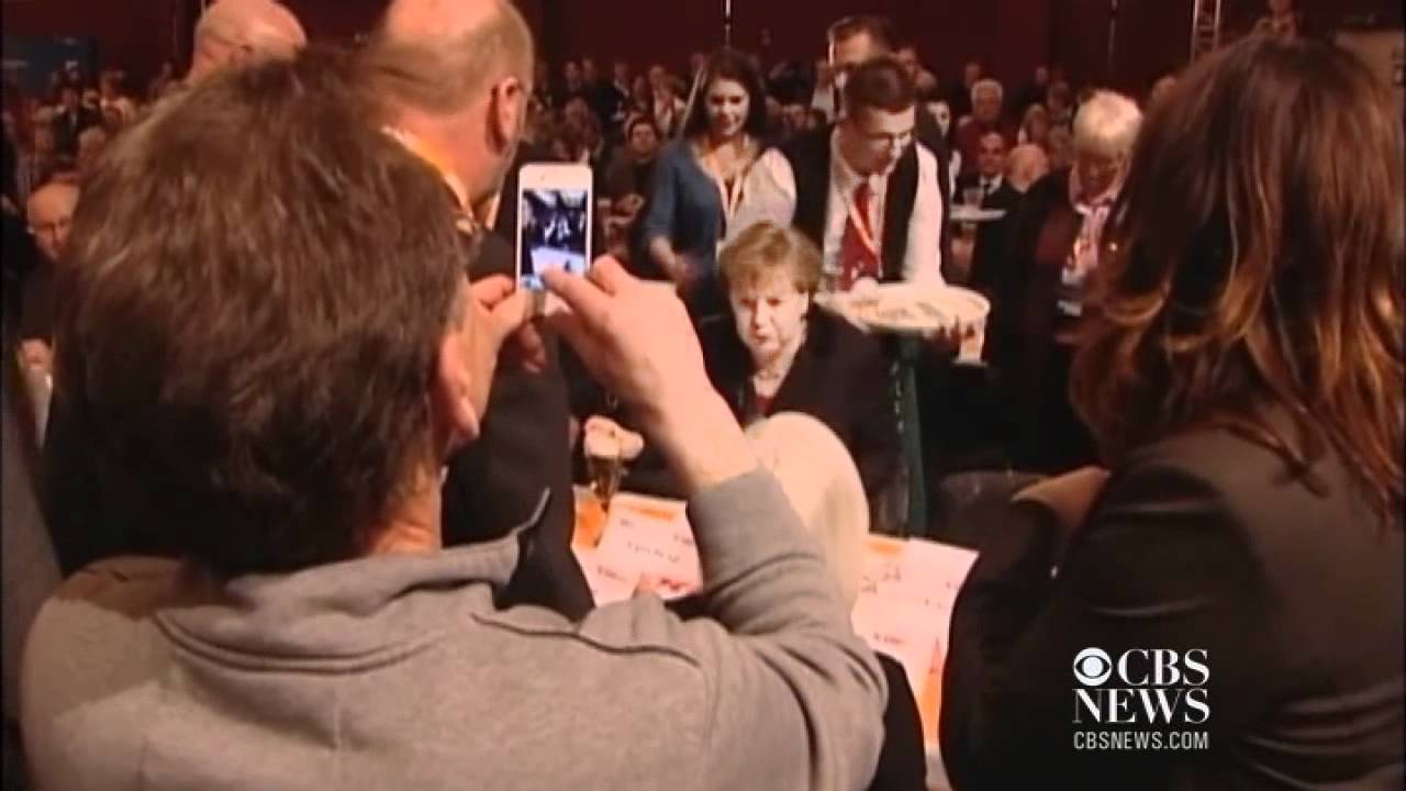Waiter spills beer on German Chancellor Merkel