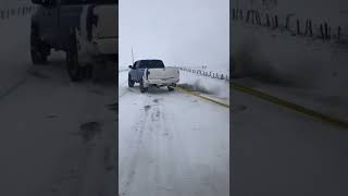 Straight pipe cummins pulling duramax out of the snow