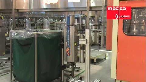 Laser Dynamark marking and coding on a PET caraffe at Nestle plant