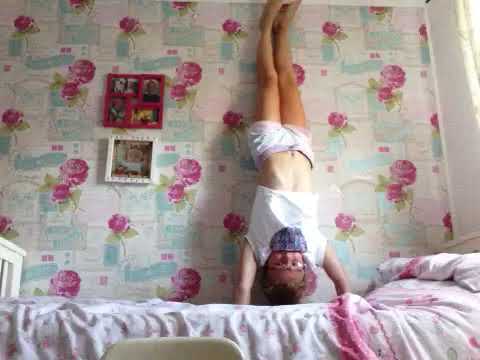 Trying to do gymnastics on my bed.