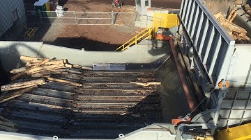 Close Up View Of 2.4m Long Logs Being Discharged From 7.5m Long Side Discharge Debarker
