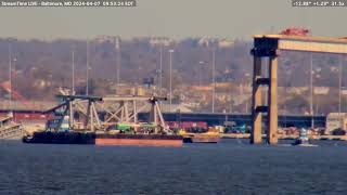 From Baltimore a Barge full of Debris from cleanup of the Francis Scott Key Bridge is hauled away