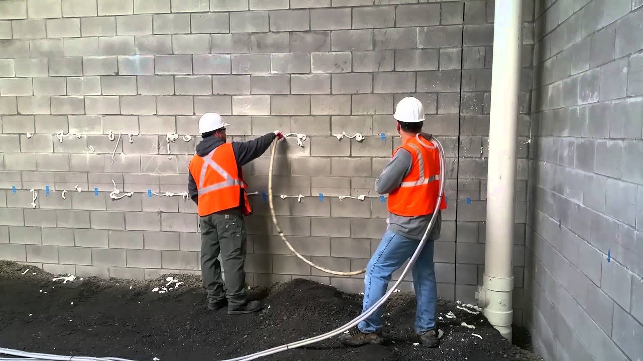 Injection foam into cinder block construction - YouTube