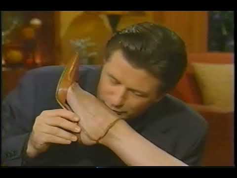 Kelly Ripa gets her foot and leg kissed by Alec Baldwin