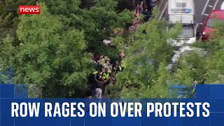 Download Lagu Row rages on over migrant protests MP3 Download Lagu Row rages on over migrant protests MP3