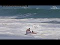 Teen lifeguard struggles to drag boy out of massive waves in California