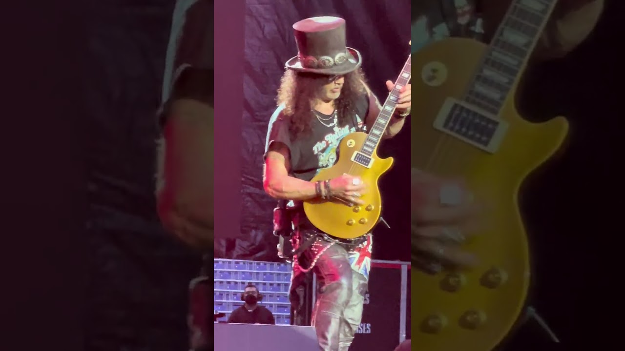 🎸🔥 Guns N’ Roses – Slash carves solos like lightning into steel 