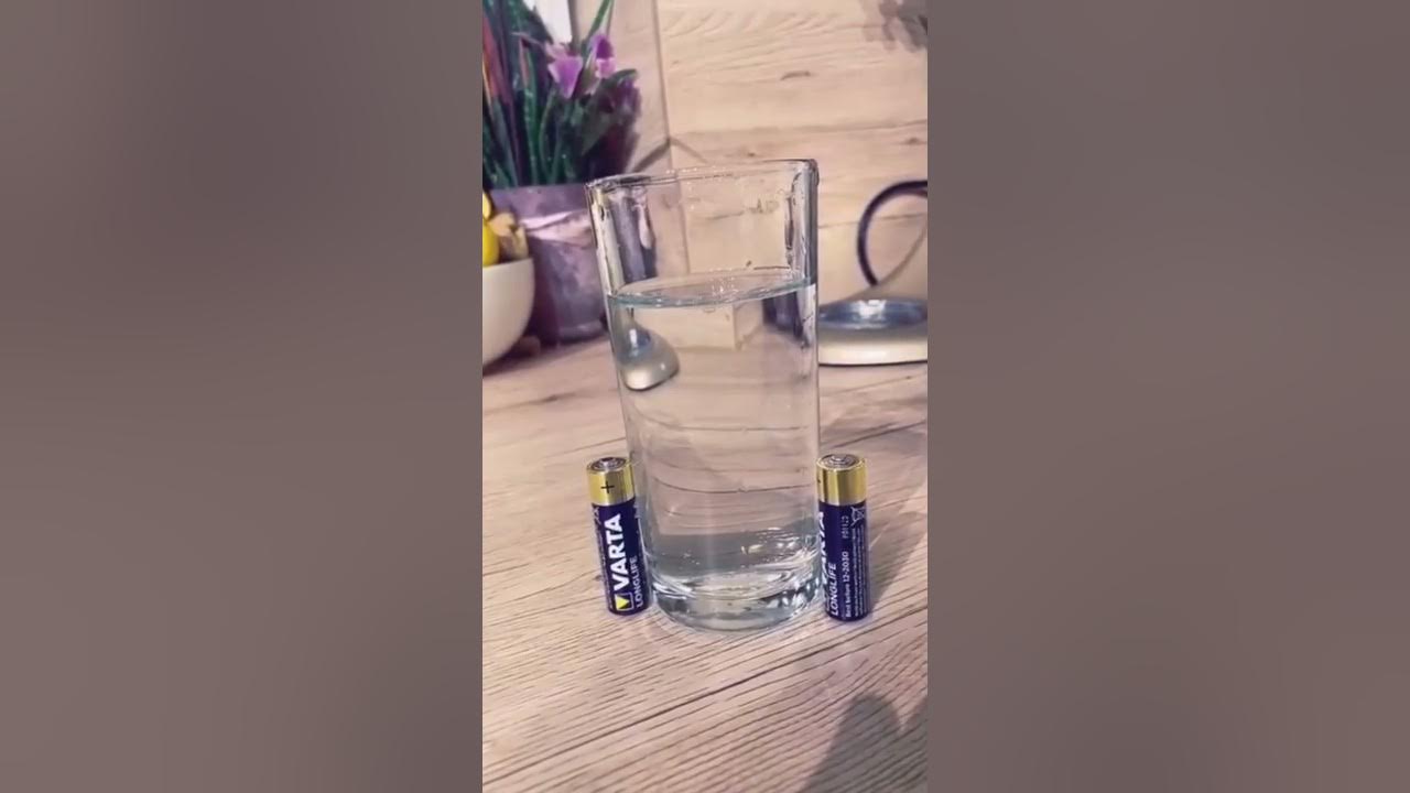 Experiment with two batteries and a glass of water #shorts Experiment with two batteries and a glass of water #shorts