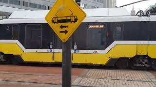 Northbound DART red line and DFW bound DART orange line trains meet near Thanksgiving Square