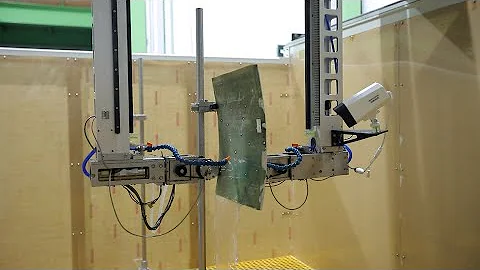 Multi-axis water spray through transmission ultrasonic testing system