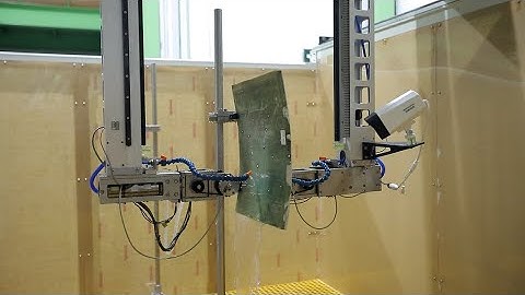 Multi-axis water spray through transmission ultrasonic testing system