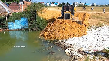 Be careful Dump truck 25.5Ton unloading stone with expert bulldozer Komatsu D41P working push soil