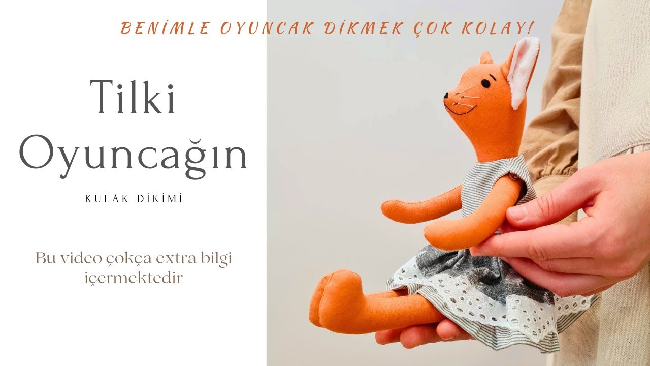 Tilki oyuncağın kulak dikimi. Oyuncak yapımı