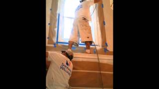 Spraying baseboards, crown molding, and finish carpentry with a Titan 440