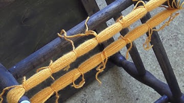 Making multiple pom poms with chair