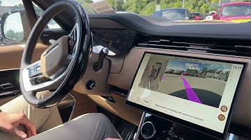 A full-sized Range Rover self-parking.