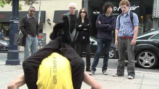 Contortionist act in downtown Toronto for local chiropractor