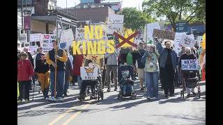 Marchers trek down Dickson Street, gather in Upper Ramble for No Kings demonstration