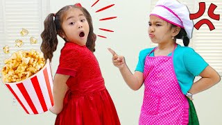 suri and annie pretend play with popcorn machine