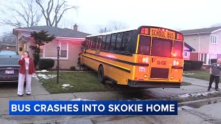 School bus crash badly damages home, but no injuries reported