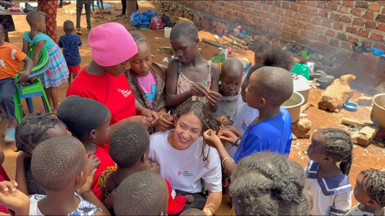 Humanity In Action! French Volunteer Having Fun With Children In Uganda