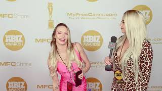 Naomi Swann wearing tight pink dress on the red carpet at the Xbiz Awards in downtown LA, CA.