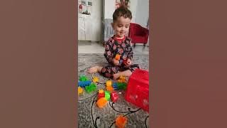 Download lagu Denise playing with her plastic bricks