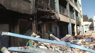 Group of displaced Palestinians move into heavily damaged school in Gaza that was run by UN agency