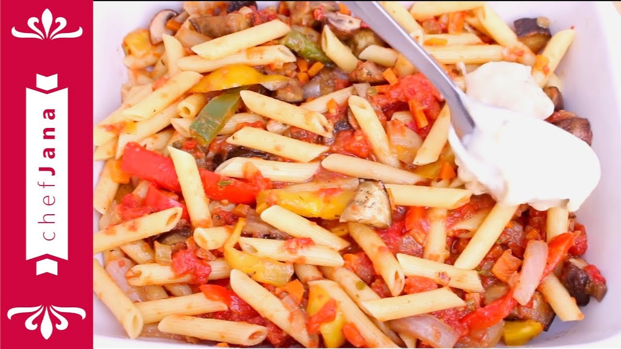 Baked penne pasta with roasted peppers in marinara sauce