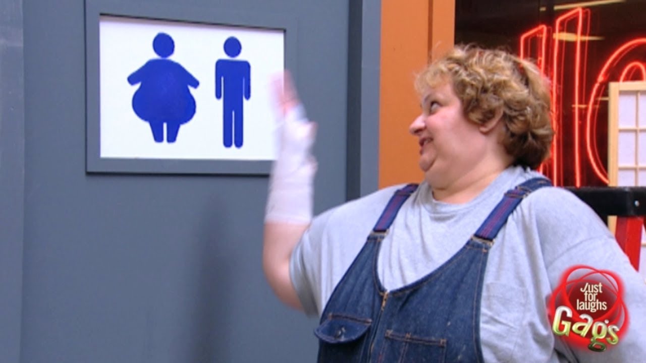 Χοντρή κυρία σε πινακίδα WC