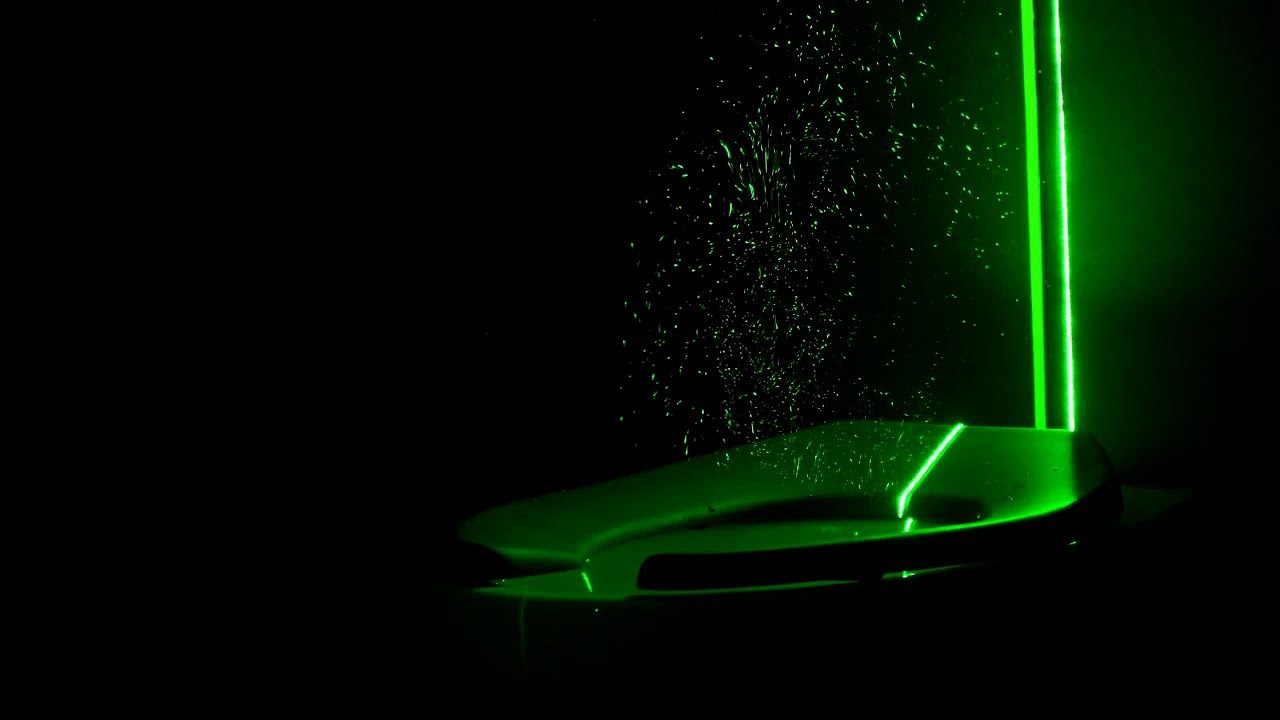 Green lasers reveal you should close the toilet lid before you flush