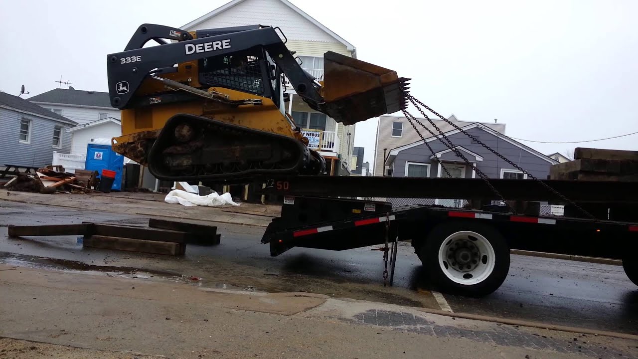 Loading skidloader without ramps - YouTube