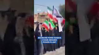 Iranians form human chain around power plant