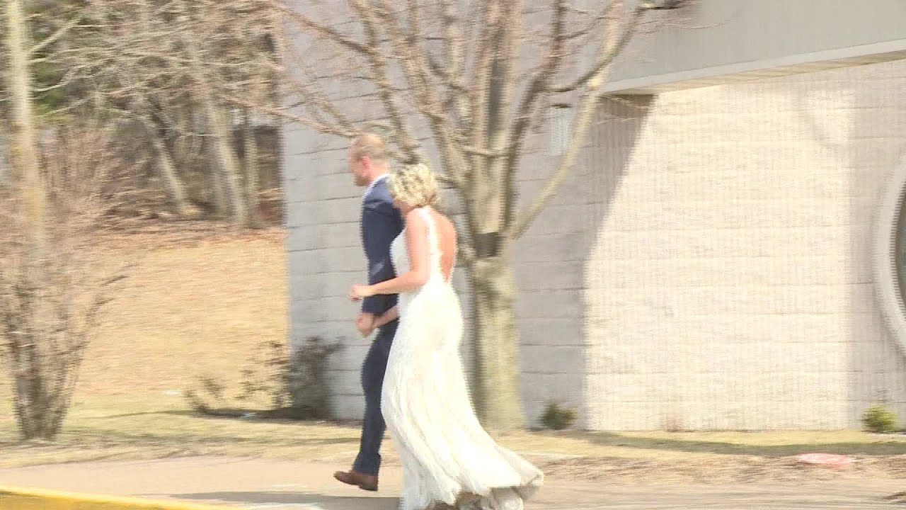 Wisconsin couple gets married with family watching from parking lot