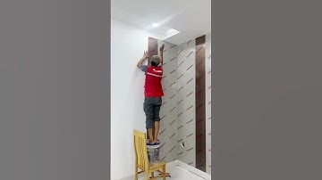 Thi công tấm ốp than tre vân vải xám kết hợp tấm ốp kim loại hiện đại