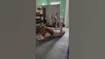Alternating single arm floor press + glute bridge isometric