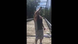Drunk man front flips off top of bridge.