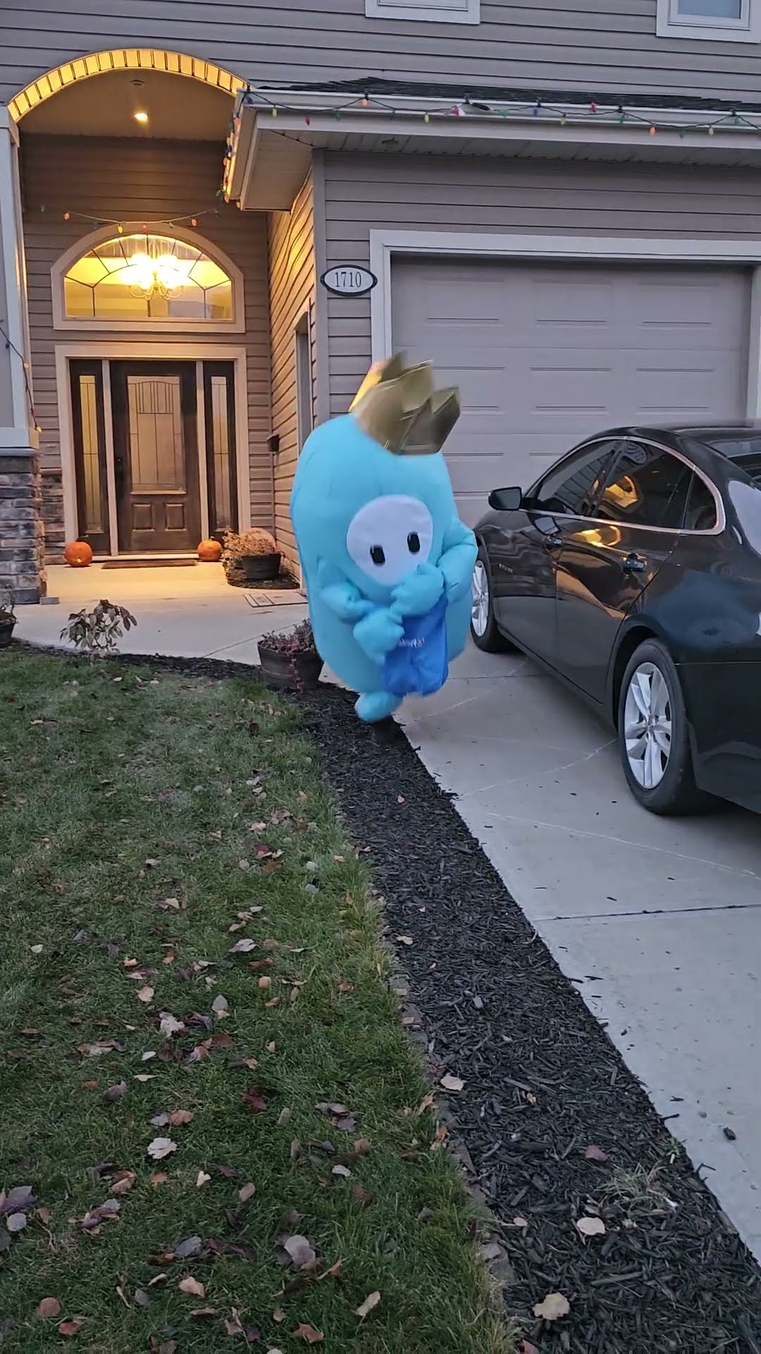 Child in an Inflatable Costume Trips and Falls While Running