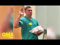 Police officer sworn in at hospital while holding newborn son