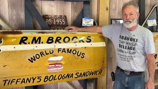 From Junk to Art: Ricky Paints a Door for Brooks General Store saying World Famous Bologna Sandwich