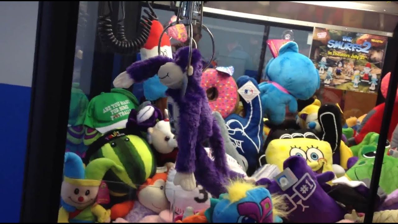 games people play 4 Awesome Claw Machine Wins - Earrings, Superman, and Collegiate Licensed Plush!