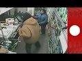 Female shopkeeper shows armed robbers who