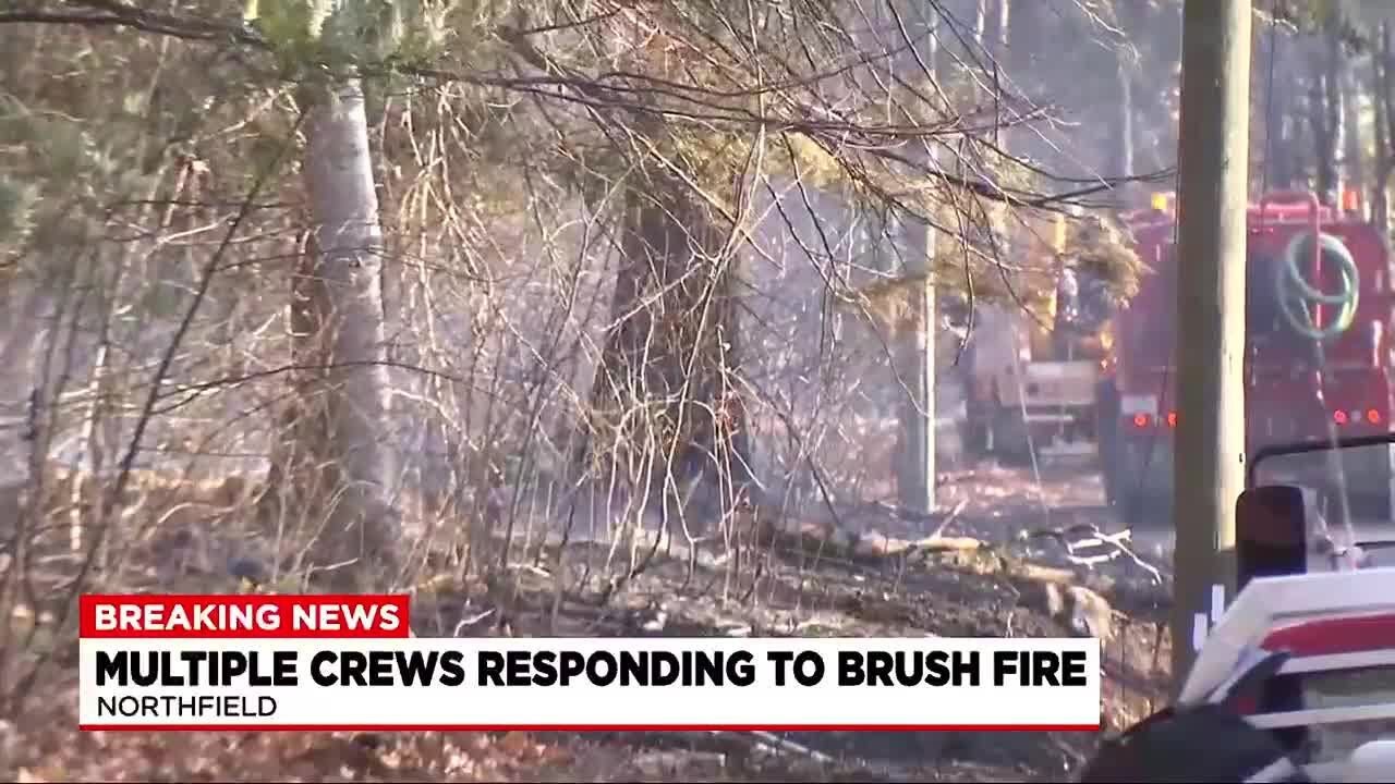 Brush fire burns several acres in Northfield - YouTube
