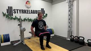 Sittande höftabduktion mot band