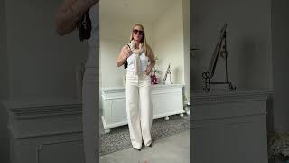 Wide-leg jeans look so much more sophisticated when paired with softer layers and refined