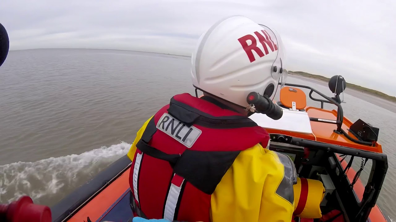 Dog walkers rescued from mud and rising tide by Hoylake RNLI hovercraft ...