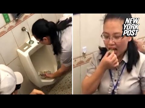 Woman eats food out of a urinal to prove its cleanliness